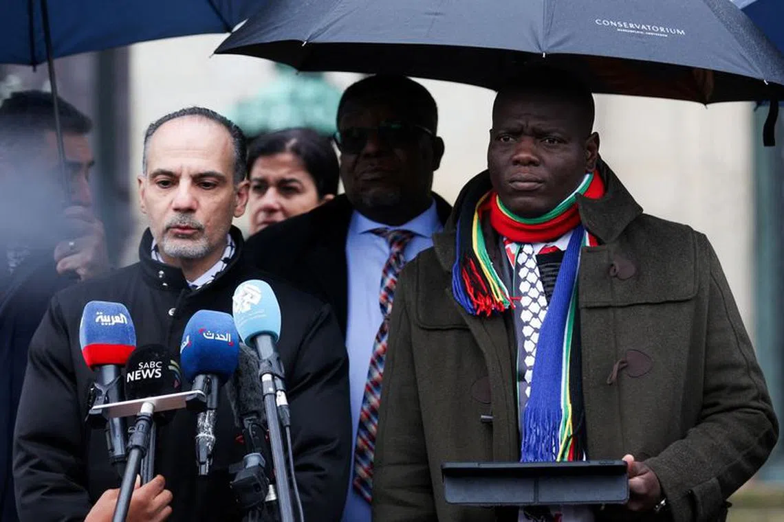 FILE PHOTO: South Africa's Minister of Justice Ronald Lamola looks on, as a member of South African delegation addresses the media near the International Court of Justice (ICJ), on the day judges hear a request for emergency measures by South Africa to order Israel to stop its military actions in Gaza, in The Hague, Netherlands January 12, 2024. REUTERS/Thilo Schmuelgen/File Photo