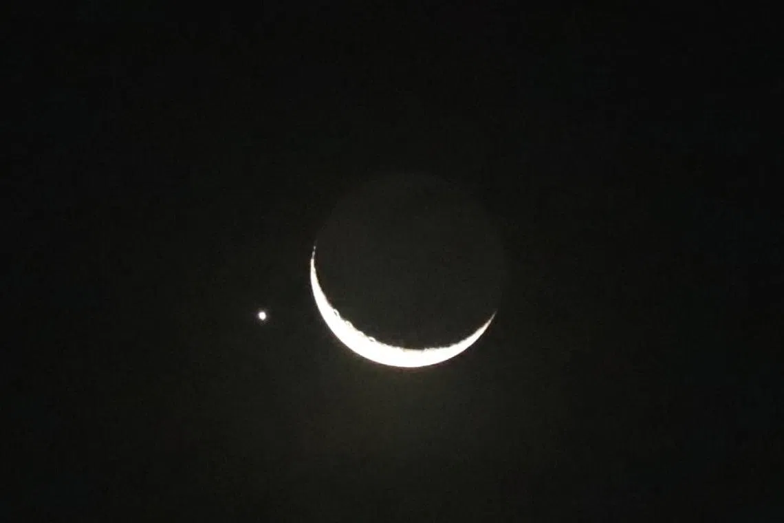 Planet of love Venus sidles up to glowing crescent moon in
