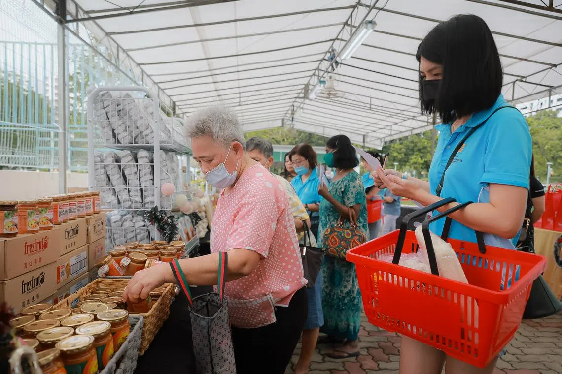 Beneficiaries can now also choose up to 12 out of 34 items in the care pack at a pop-up market in Limbang Park in Choa Chu Kang.