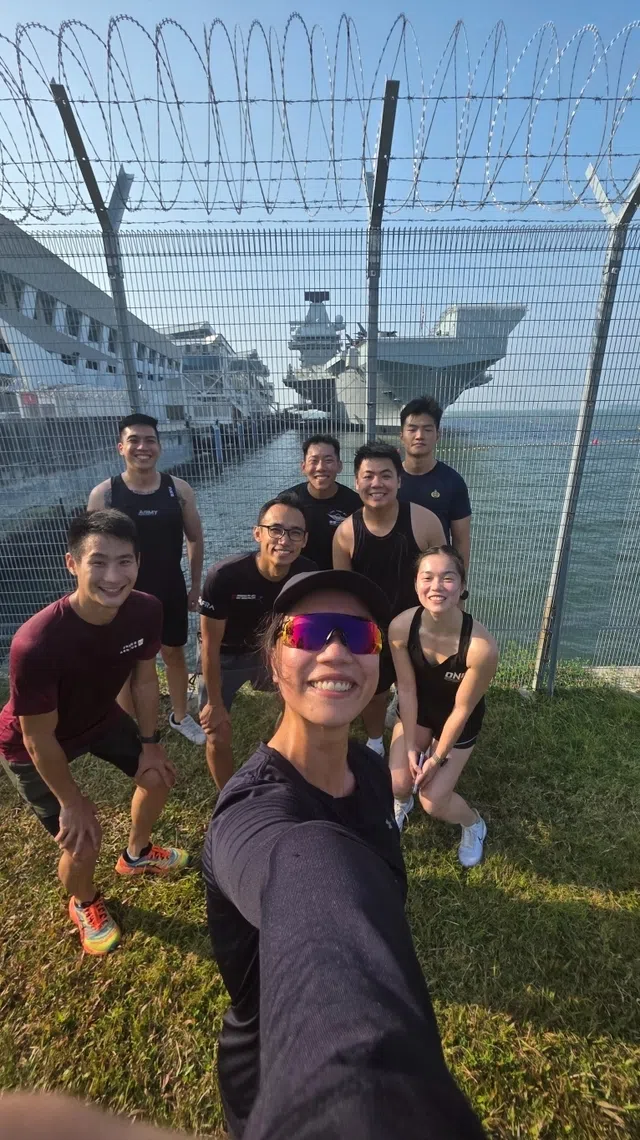 major jina lim with fellow navy officers on a run to the marina bay cruise centre to see hms prince of wales navy vessel, one of world’s largest warships, in june 2025