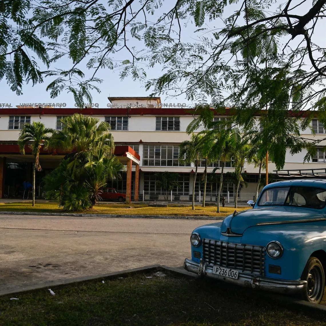 A vintage car is parked outside the Provincial Clinical–Surgical Hospital \"Arnaldo Milian Castro,\" where, according to local information, injured people were being treated after an armed incident involving a Florida-registered speedboat and a Cuban patrol, at a time of heightened tensions with the U.S., in Santa Clara, Cuba, February 26, 2026. REUTERS/Norlys Perez