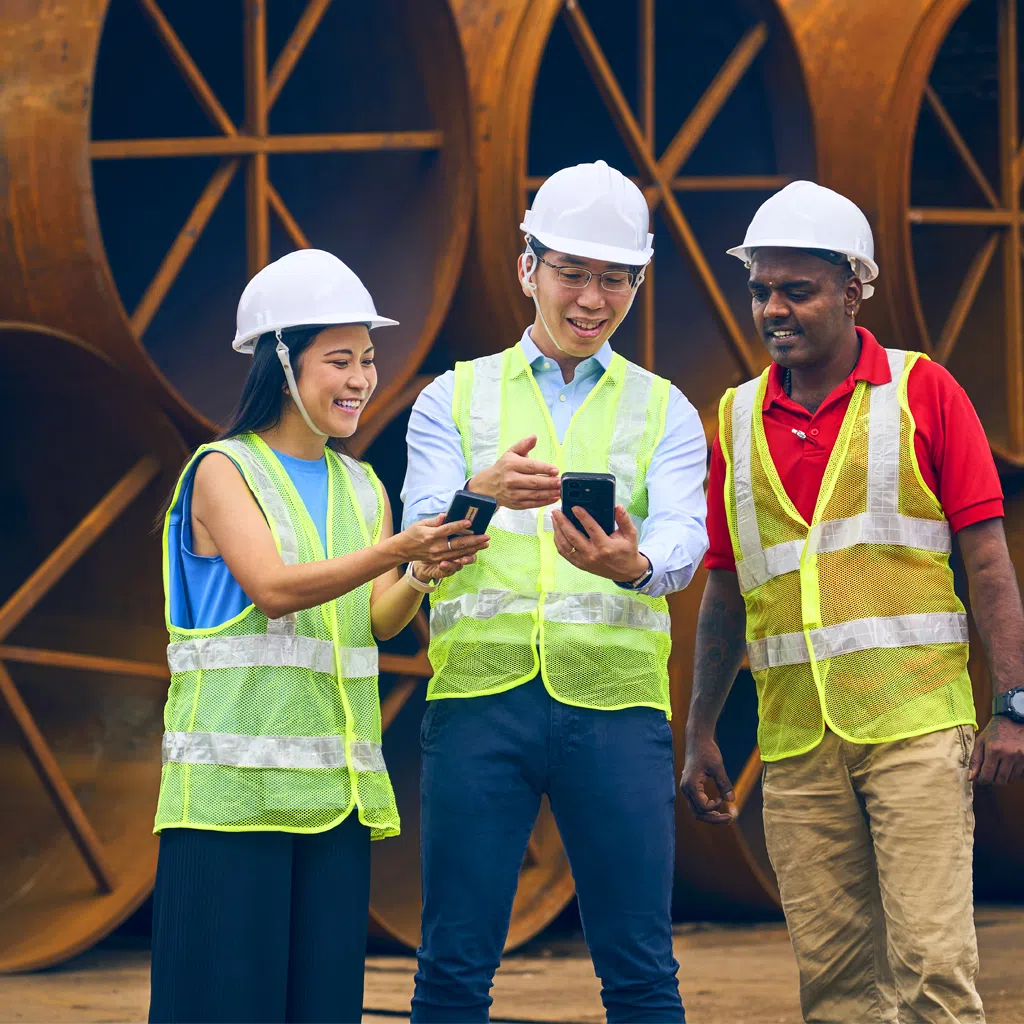 Chairman and chief executive officer Eric Leong (centre, pictured with wife Sarah Siew, who is chief of staff, and yard personnel, Mathavan Subramani) built Mlion Corporation from $100,000 in 2011 to a multimillion-dollar steel distributor operating across nine markets. 