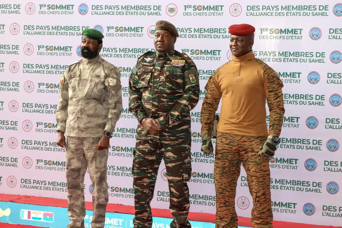 (From left) Interim President of Mali, Colonel Assimi Goita, head of the military junta in Niger, General Abdourahamane Tchiani, and interim leader of Burkina Faso, Captain Ibrahim Traore, posing for photos at the start of the first-ever Alliance of Sahel States summit, on July 6.
