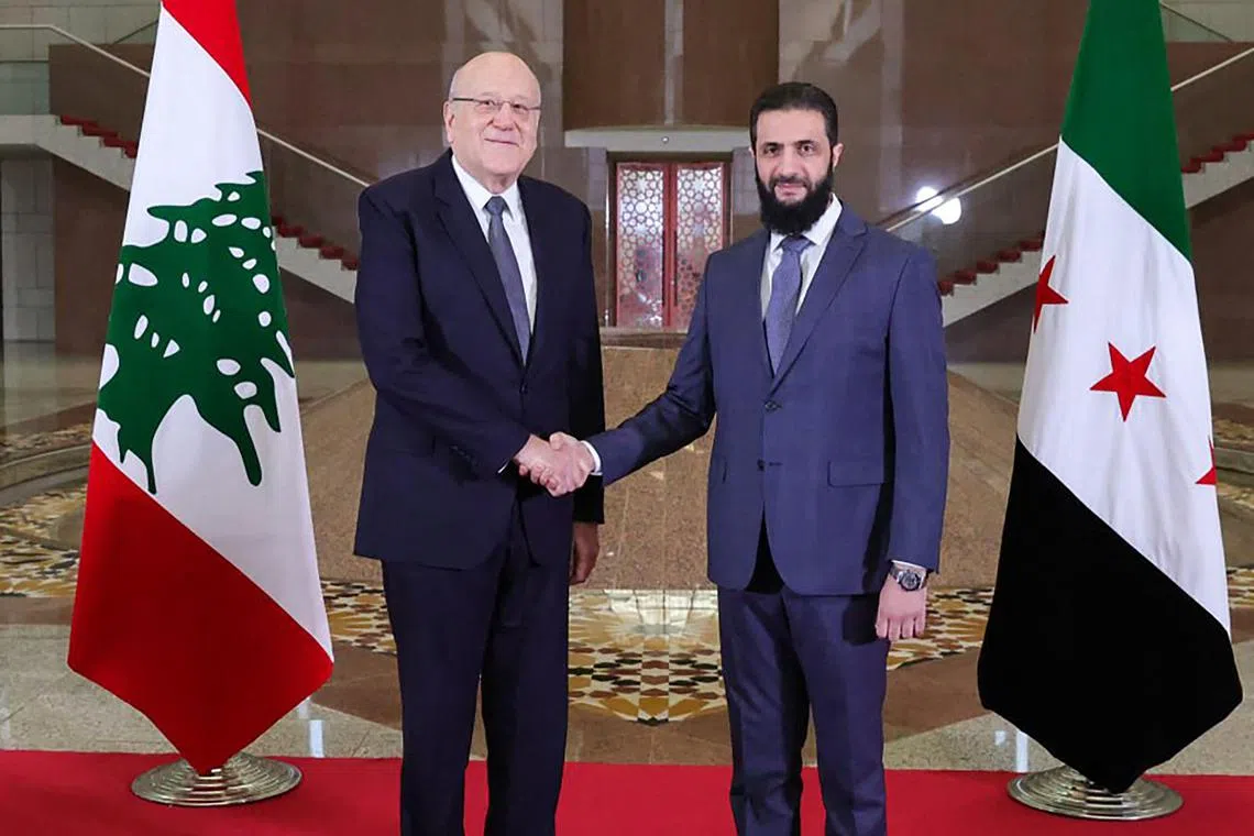 Lebanon's Prime Minister Najib Mikati (left) is welcomed to Damascus by Syria's new leader, Mr Ahmed al-Sharaa, on Jan 11.