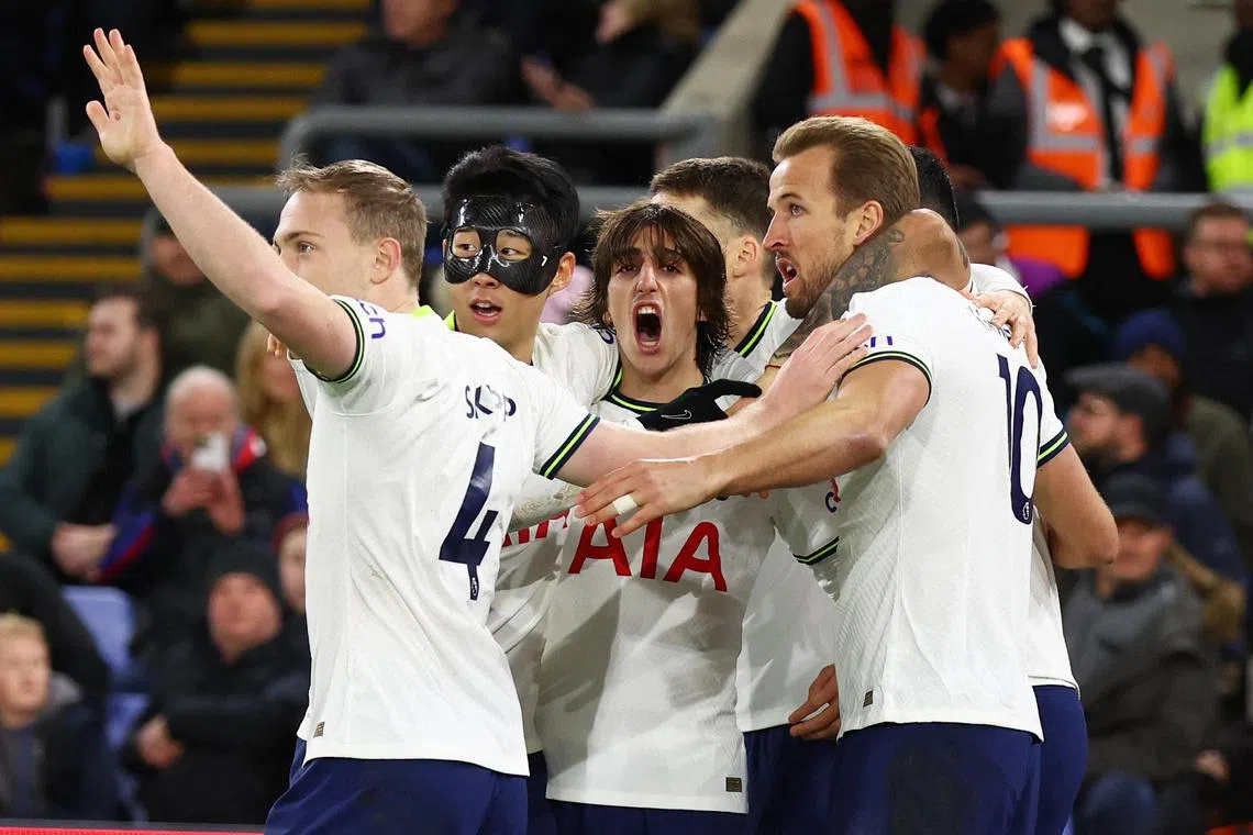 Tottenham Hotspur's Harry Kane celebrates scoring their first goal with teammates.