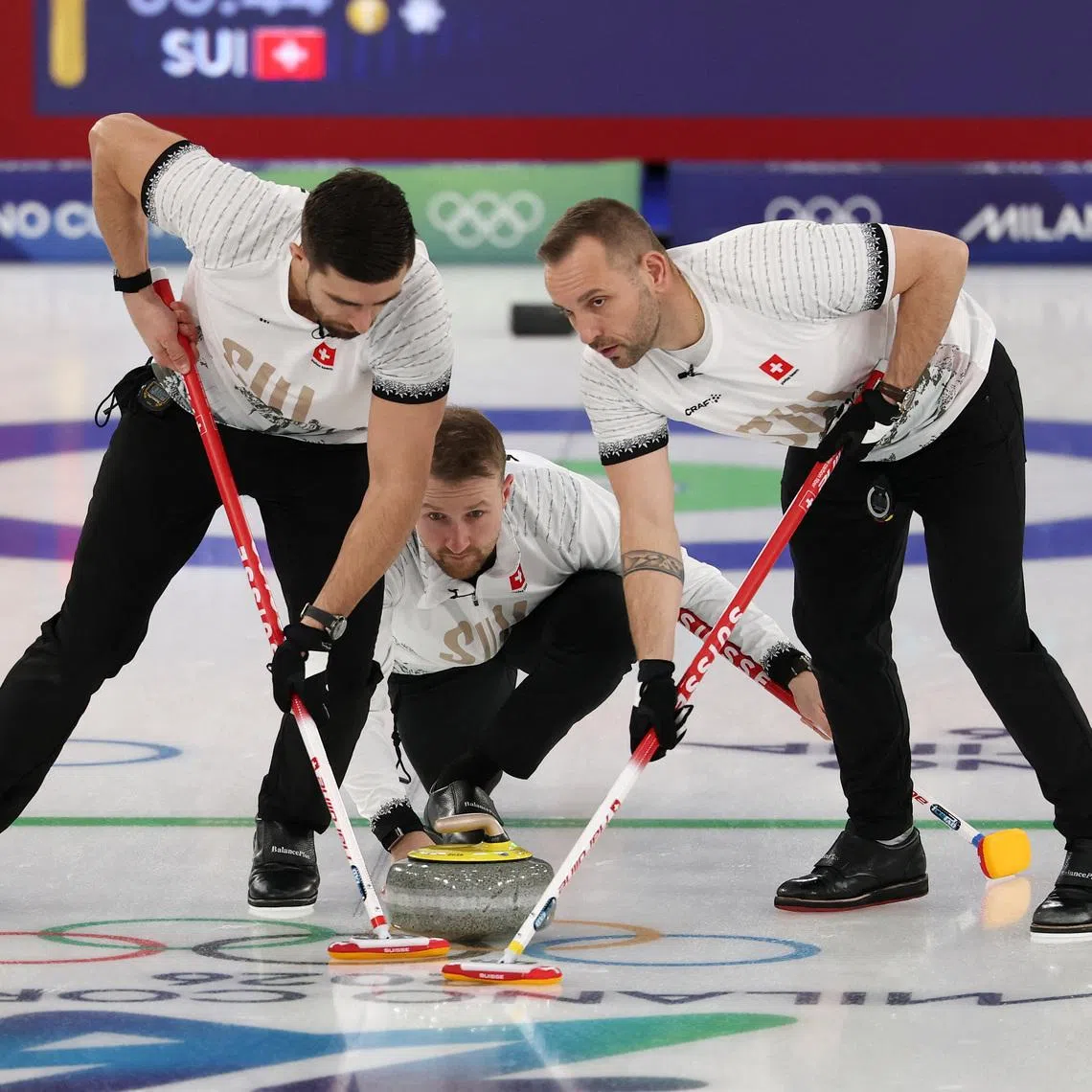 Milano Cortina 2026 Olympics - Curling - Men's Round Robin Session 11 - Norway vs Switzerland - Cortina Curling Olympic Stadium, Cortina d'Ampezzo, Italy - February 18, 2026. Yannick Schwaller of Switzerland, Sven Michel of Switzerland and Pablo Lachat-Couchepin of Switzerland in action during the match against Norway REUTERS/Issei Kato