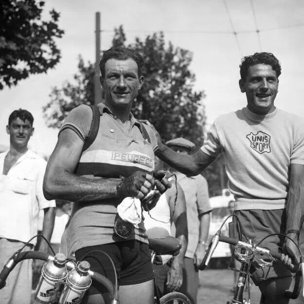 French cyclist Charles Coste (right) poses with an unidentified rider in July 1950 during the 37th edition of the Tour de France.