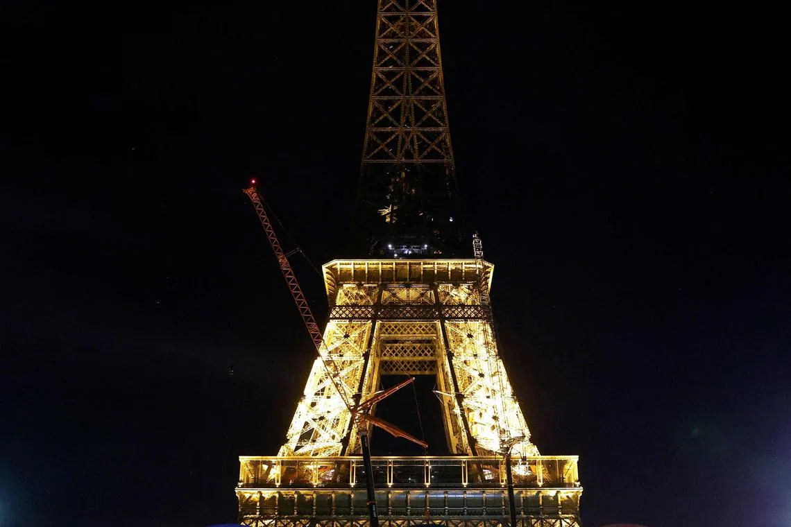 The Eiffel Tower is pictured after workers removed the Olympic rings on it, in Paris, on Sept 27.