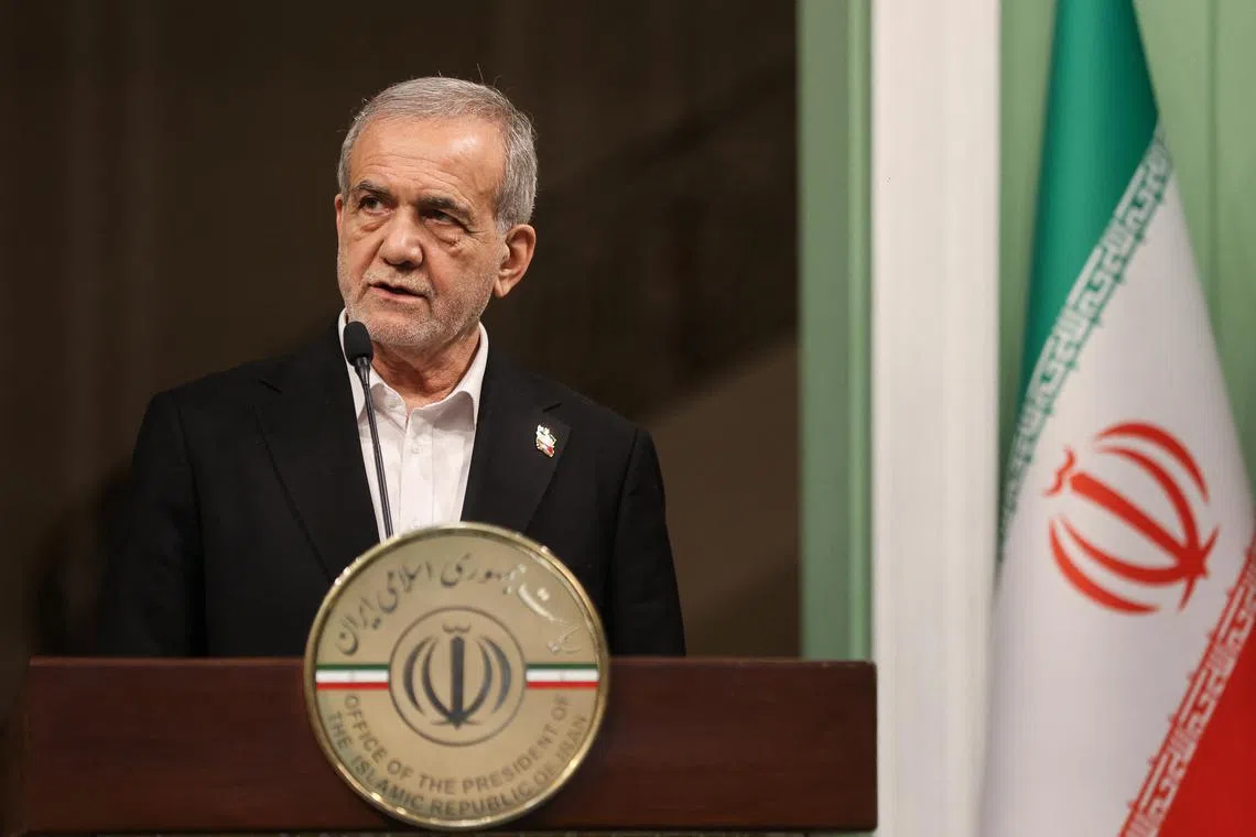 Iranian President Masoud Pezeshkian looks on as he attends a press conference with Emir of Qatar Sheikh Tamim bin Hamad Al Thani (not pictured), in Tehran, Iran. February 19, 2025. Majid Asgaripour/WANA (West Asia News Agency) via REUTERS/File Photo