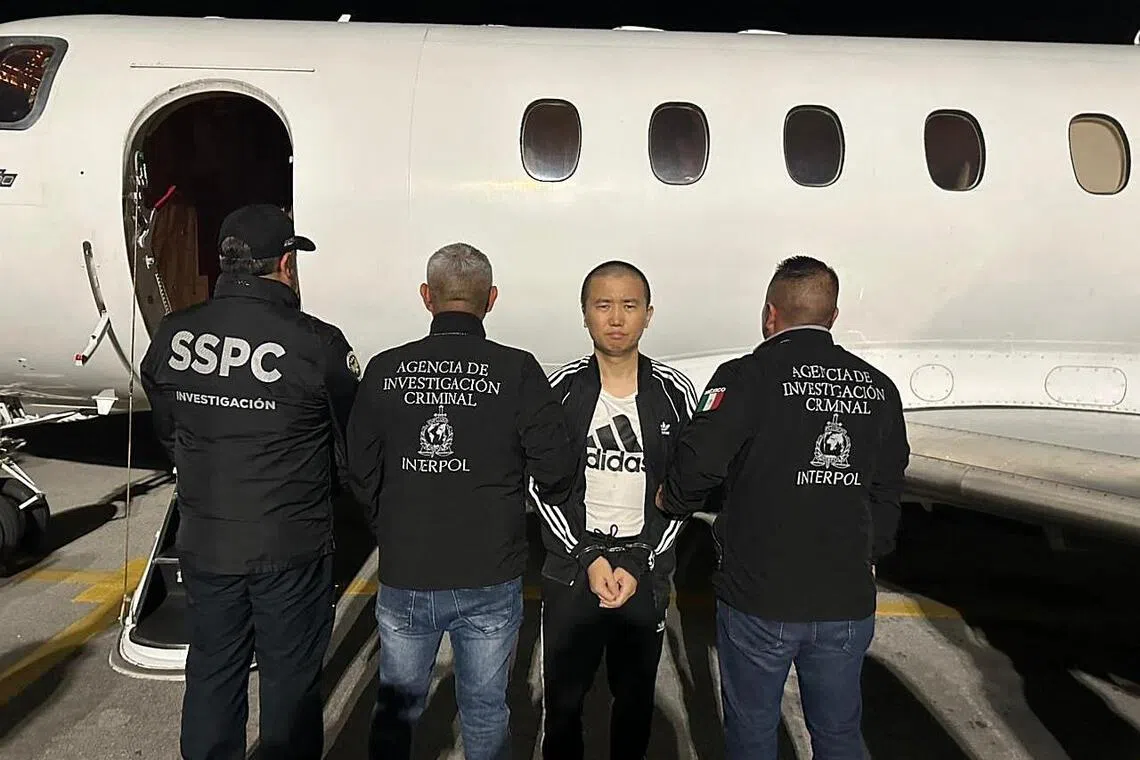 Alleged Chinese fentanyl kingpin Zhang Zhi Dong escorted by Interpol officers in Mexico City during his transfer to US authorities.