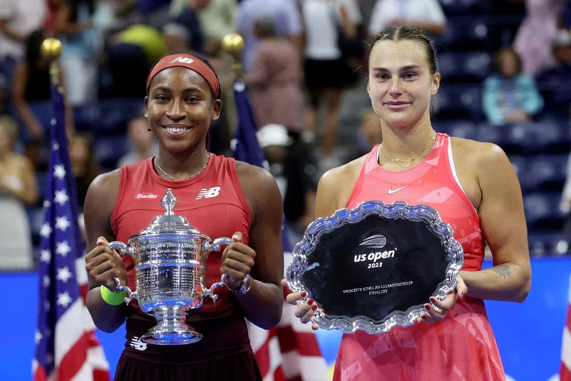 FILE PHOTO: Tennis - U.S. Open - Flushing Meadows, New York, United States - September 9, 2023 Coco Gauff of the U.S. celebrates with the trophy and second place Belarus' Aryna Sabalenka after winning the U.S. Open REUTERS/Mike Segar/File Photo