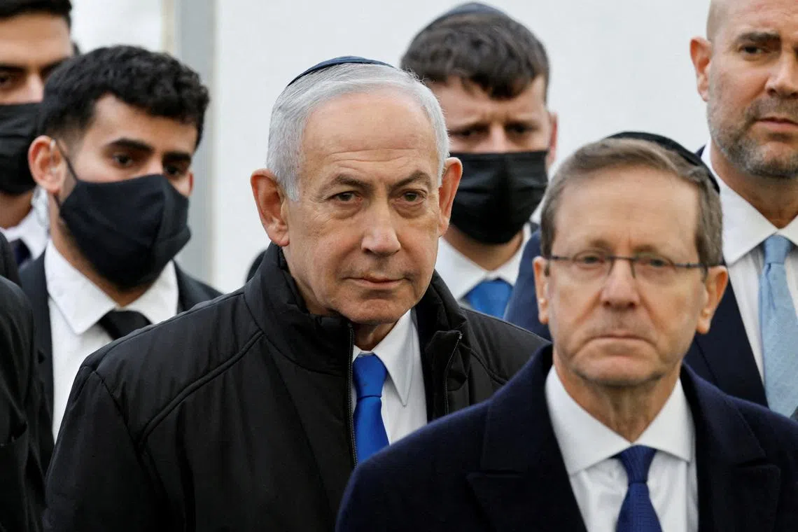 FILE PHOTO: Israeli Prime Minister Benjamin Netanyahu and Israeli President Isaac Herzog attend a memorial service in Meitar, Israel, January 28, 2026. REUTERS/Amir Cohen/File Photo