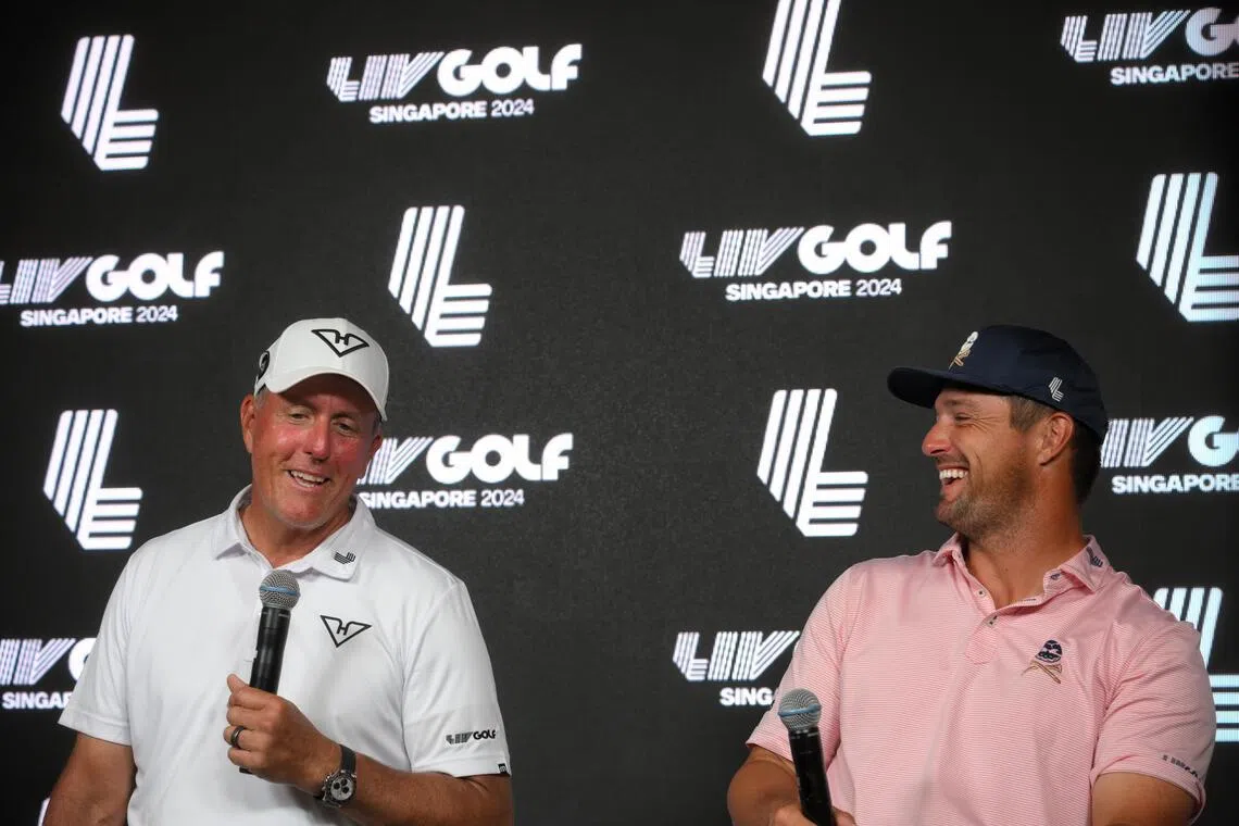 American golfers Phil Mickelson (left) and Bryson DeChambeau at a 2024 Liv Golf Singapore press conference.