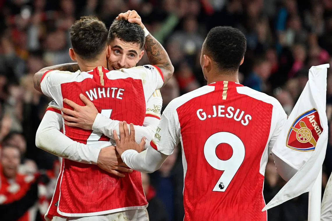 Arsenal's Kai Havertz is mobbed by teammates after scoring the team's second goal against Brentford.
