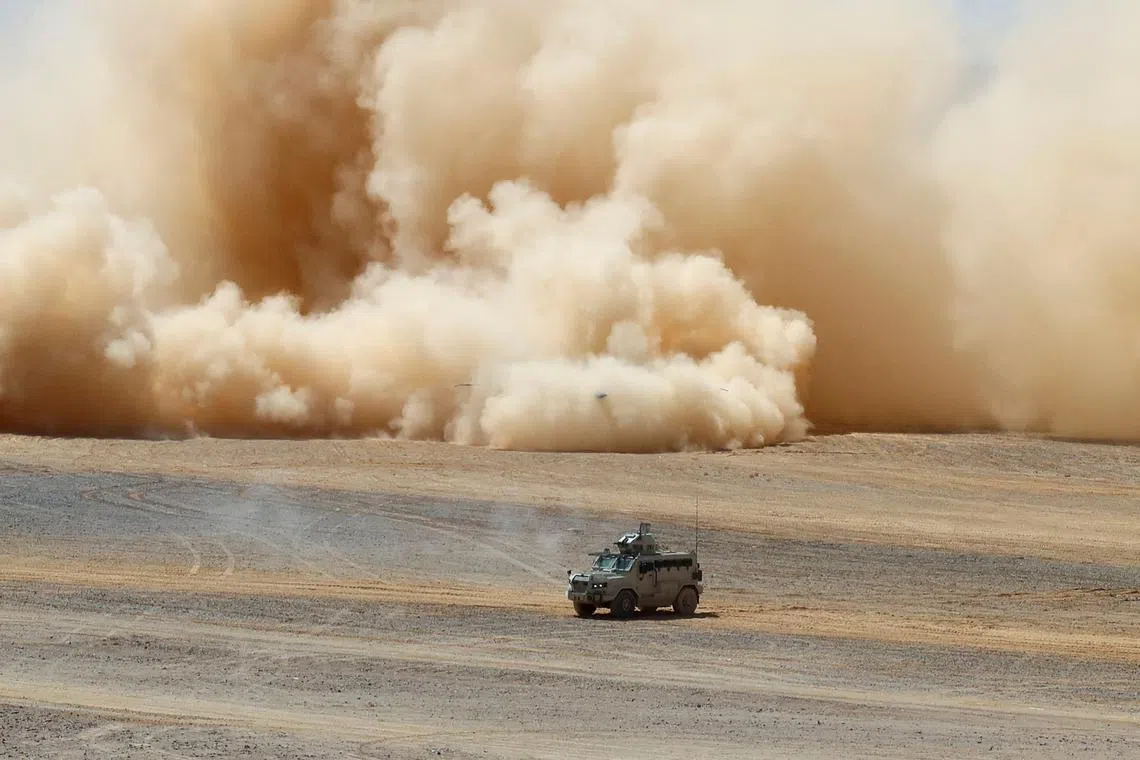 A military vehicle driving during the 'Eager Lion' joint military drills with the participation of the Jordanian Armed Forces, the U.S. and other partner countries, in Maan, Jordan, on May 23, 2024. 