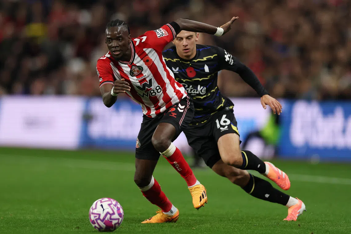 Soccer Football - Premier League - Sunderland v Everton - Stadium of Light, Sunderland, Britain - November 3, 2025 Sunderland's Bertrand Traore in action with Everton's Vitaliy Mykolenko Action Images via Reuters/Lee Smith