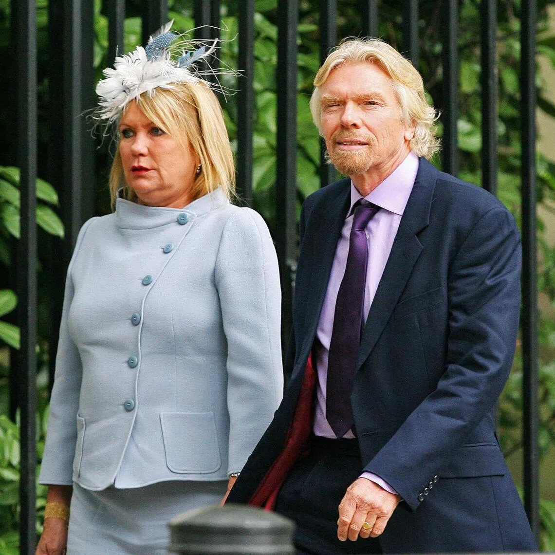 (FILES) Chairman of Virgin Airlines, Richard Branson, arrives with his wife Joan at Wellington barracks London for Princess Diana's memorial service on August 31, 2007. British entrepreneur Richard Branson paid tribute on November 26, 2025 to his wife Joan Templeman shortly after announcing her death, saying "life will never be the same without her". The founder of the Virgin Group had revealed Templeman's death, aged 80, in an Instagram post late on November 25, saying he was "heartbroken". (Photo by Carl DE SOUZA / AFP)