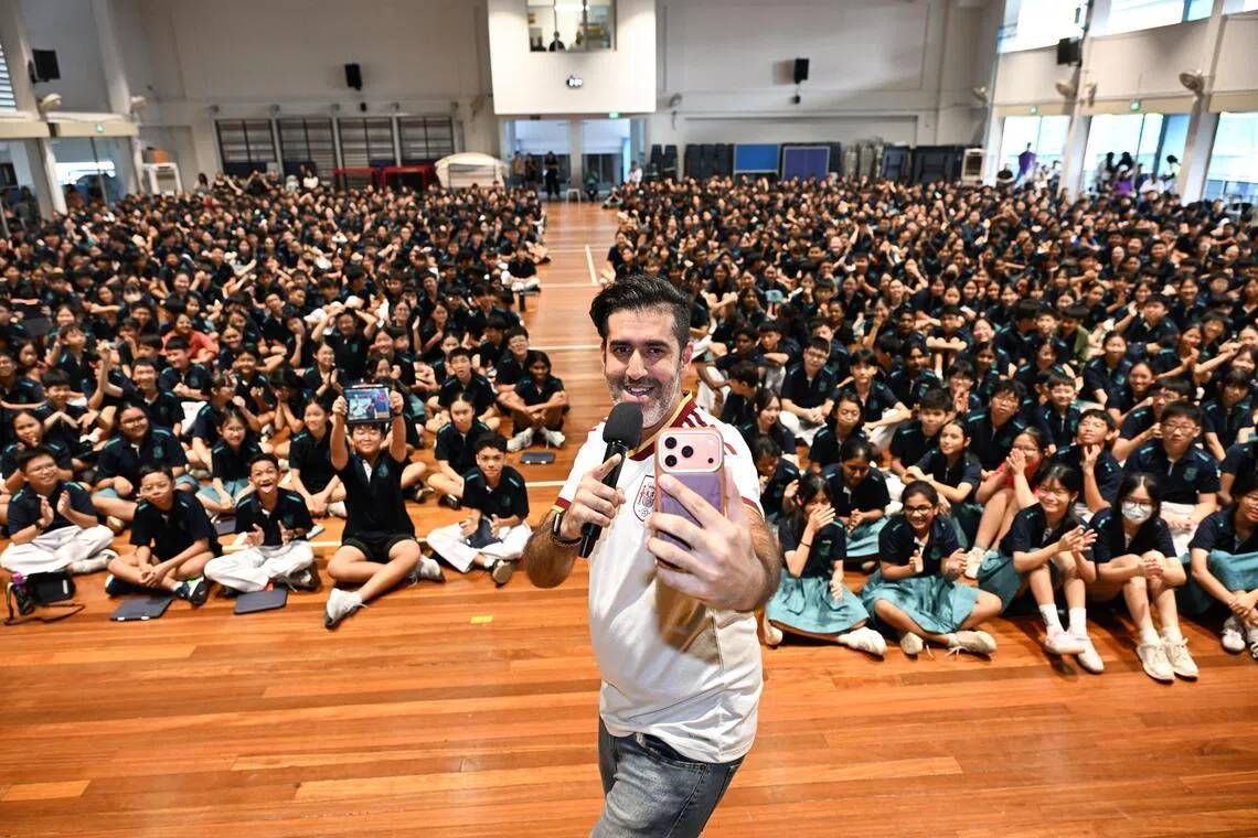 Students from Swiss Cottage Secondary School participating in the What’s the News? assembly programme, hosted by local comedian Rishi Budhrani, on July 9.