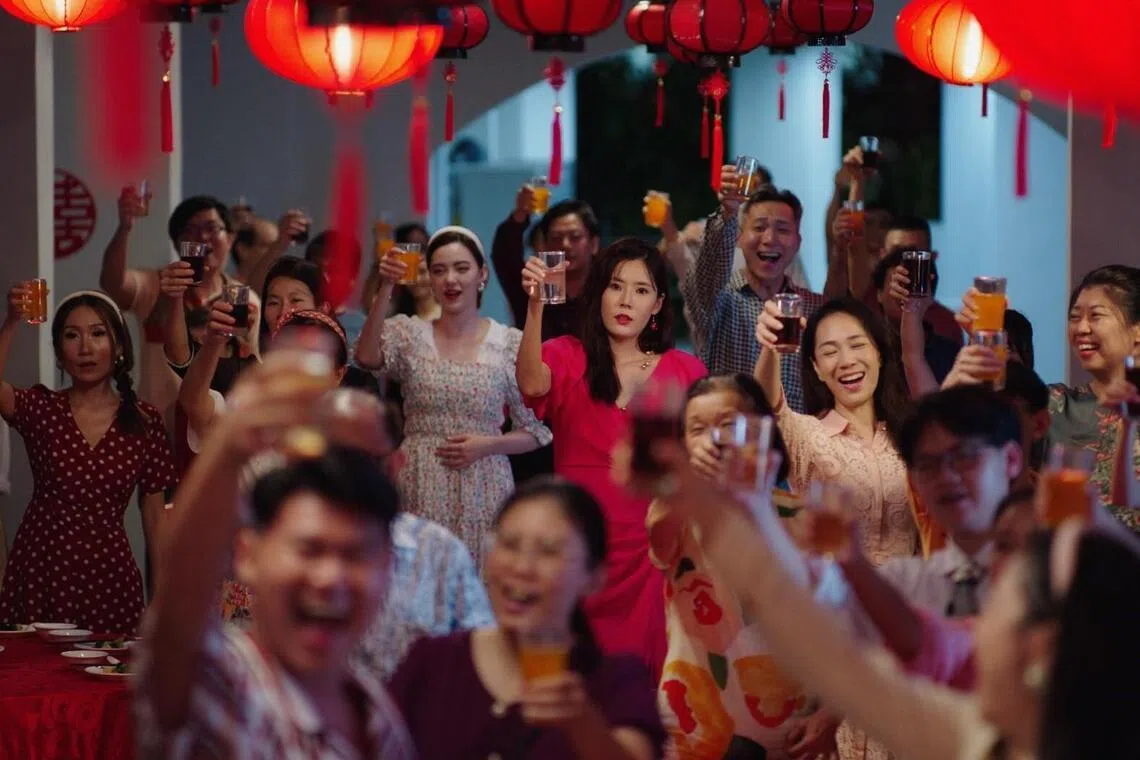 Carrie Wong (in red dress) played a chain-smoking, vulgarity-spewing mother in the local movie Ah Girl.