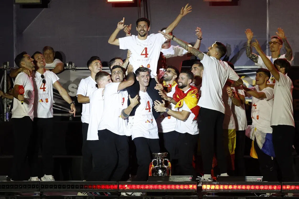 FILE PHOTO: Soccer Football - Euro 2024 - Spain Parade after winning Euro 2024 - Madrid, Spain - July 15, 2024 Spain's Jesus Navas, Alvaro Morata and  teammates celebrate on Plaza Cibeles after winning Euro 2024 REUTERS/Juan Medina/File Photo