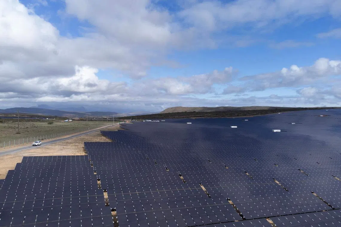 TOPSHOT - A general view of the Paleisheuwel solar plant, which was established by Italy-based Enel Green Power, in partnership with South African electricity public utility Eskom, in Paleisheuwel on June 5, 2024. This solar plant can produce 82MW of electricity, which can power 48000 households. (Photo by RODGER BOSCH / AFP)