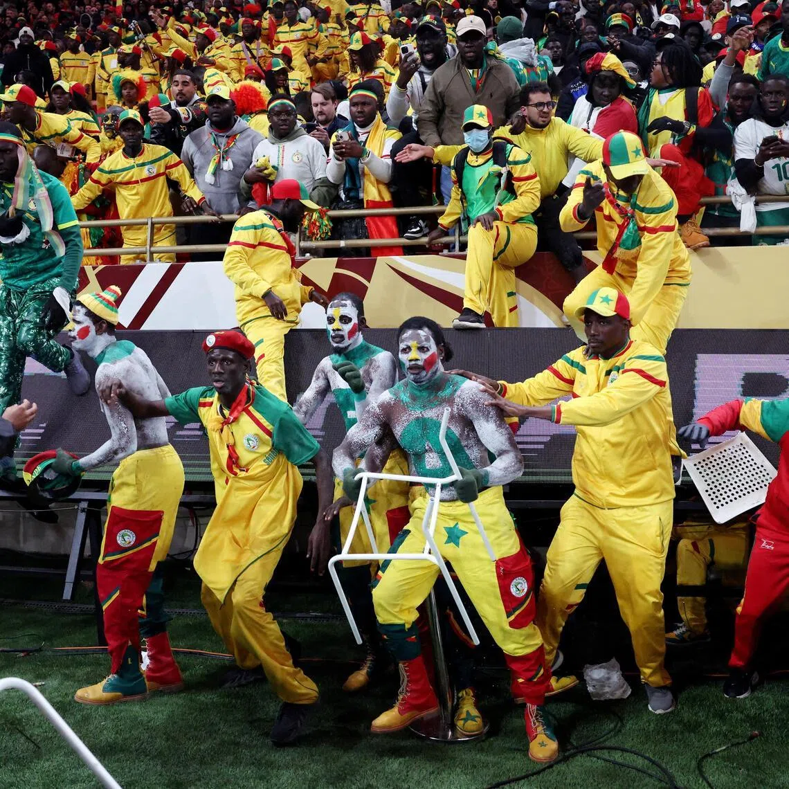 Senegal fans clash with security as fans invade the pitch after Morocco were awarded a penalty following a VAR review in the Africa Cup of Nations final.