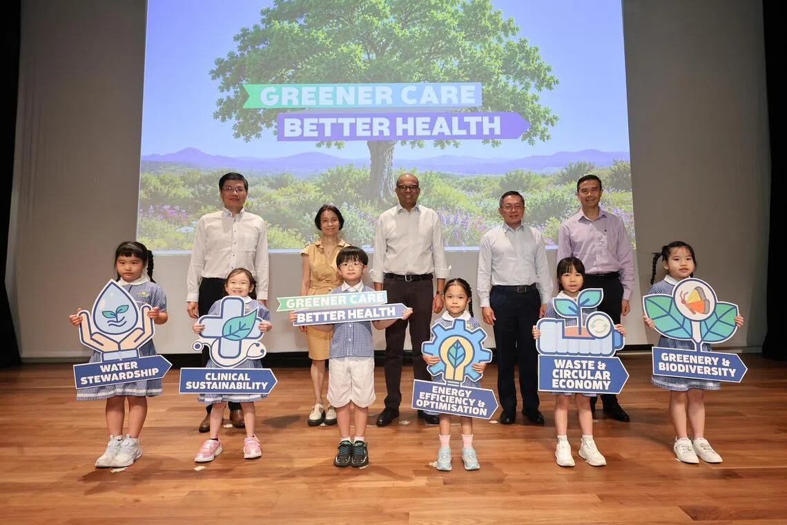(Back row, from left) National University Health System group chief operating officer Jeffrey Chun, SingHealth group director for sustainability Chow Wan Cheng, Senior Minister of State for Sustainability and the Environment Janil Puthucheary, NHG Health group chief executive officer Joe Sim, and Kwong Wai Hsiu Hospital chief executive officer Mok Ying Jang with children from Learning Vision pre-school on Oct 27.