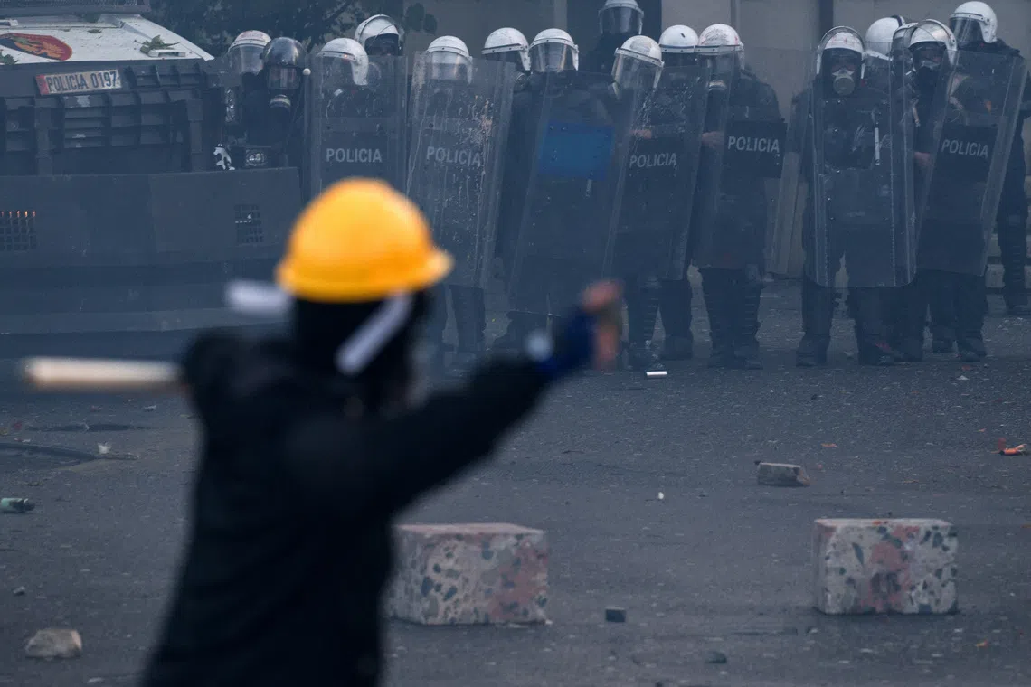 Police officers in riot gear stand next to an armoured vehicle during an anti-government protest by students in Tirana, Albania, October 24, 2026. REUTERS/Florion Goga
