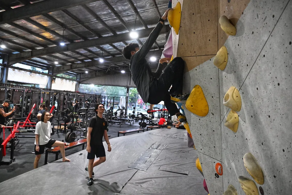 Climbers at the rock wall gym in Ark Bloc gym and fitness centre at Punggol East Container Park on Sept 1.