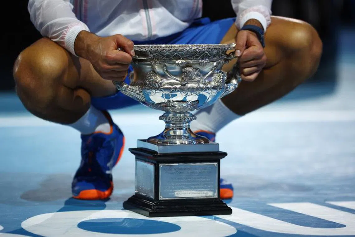 Tennis - Australian Open - Men's Singles Final - Melbourne Park, Melbourne, Australia - January 29, 2023 Serbia's Novak Djokovic celebrates with the trophy after winning his final match against Greece's Stefanos Tsitsipas REUTERS/Hannah Mckay/ File Photo