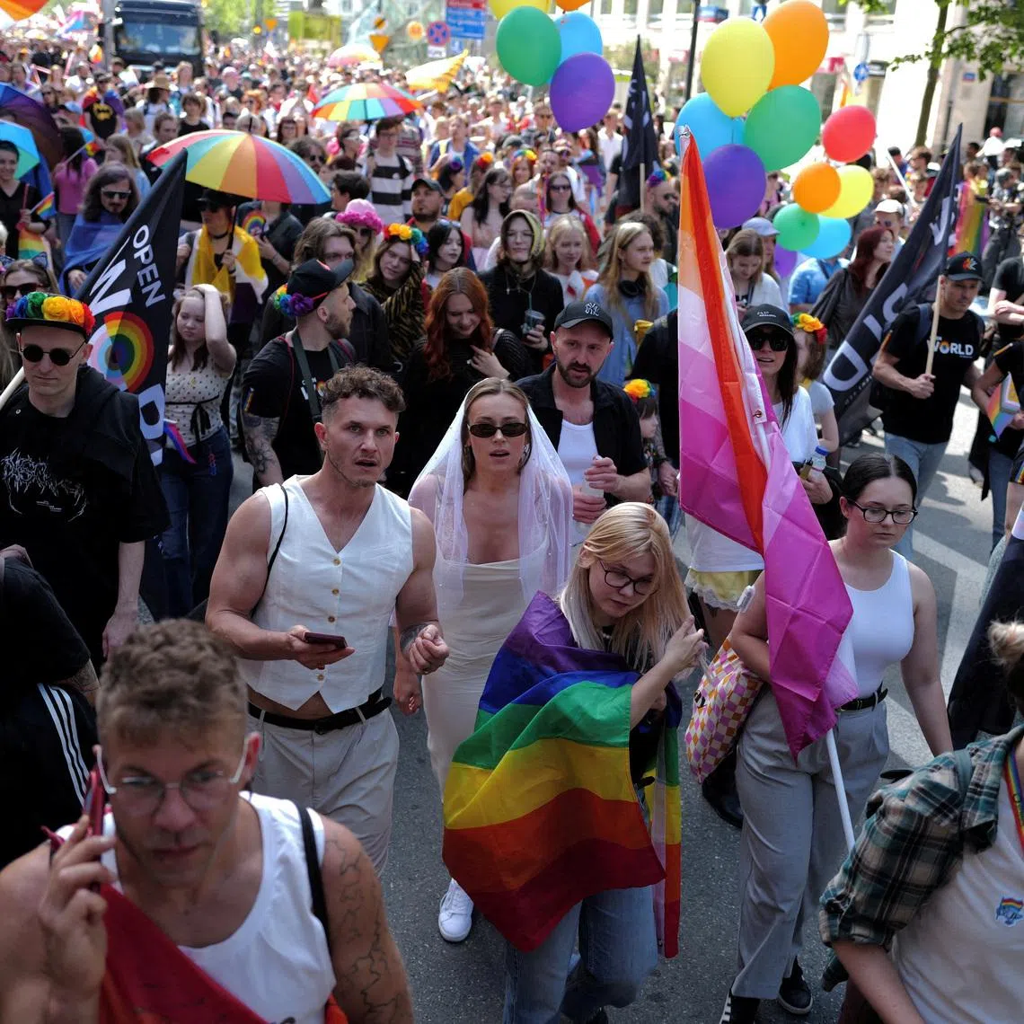 FILE PHOTO: People take part in the annual LGBTQ+ Equality Parade, marking the 25th anniversary of Warsaw’s first LGBTQ+ march, in Warsaw, Poland, June 13, 2026. REUTERS/Kacper Pempel/File Photo