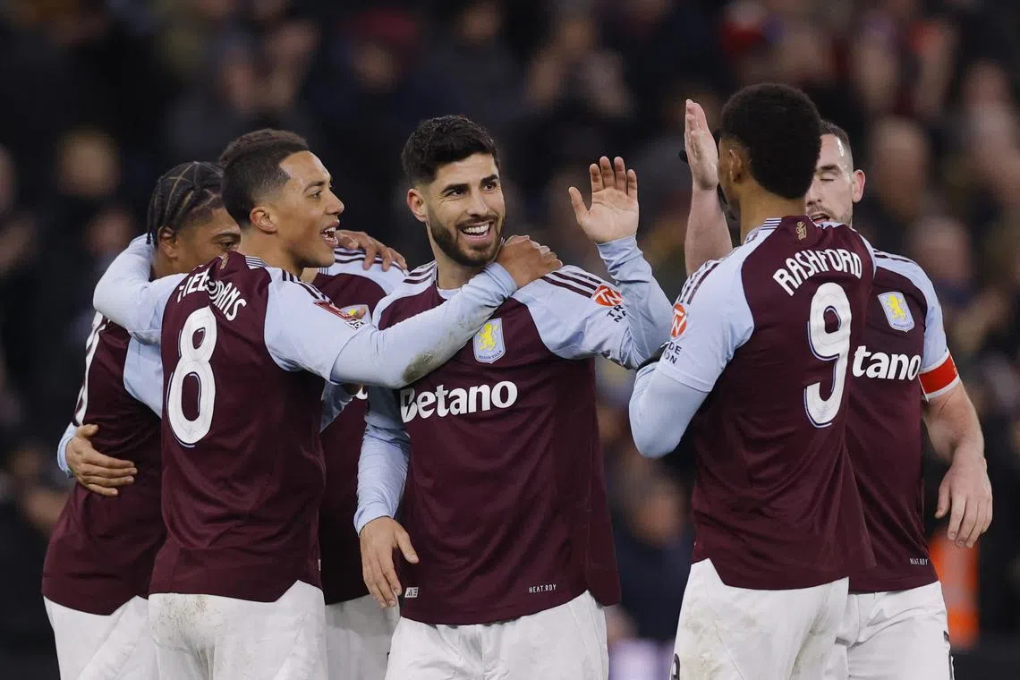 Aston Villa's Marco Asensio celebrates scoring their second goal with teammates.