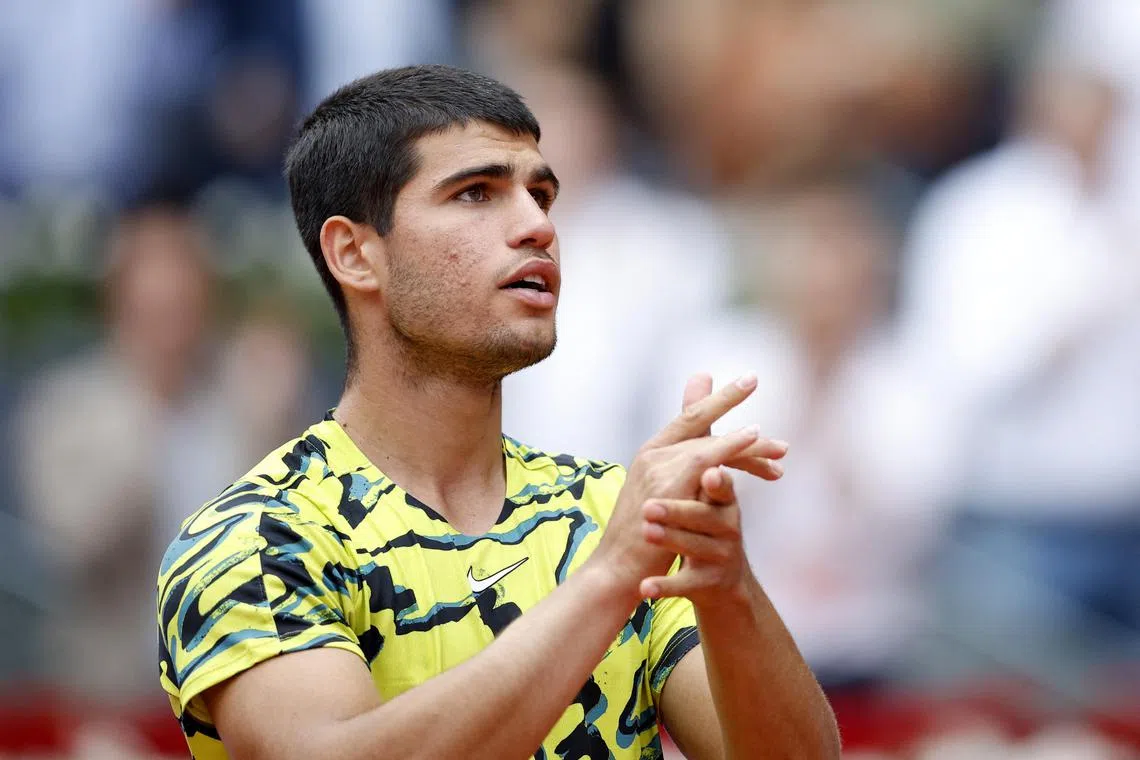 Defending champion Carlos Alcaraz, of Spain, celebrates his win against Finland's Emil Ruusuvuori.
