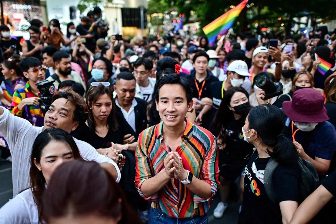 Move Forward Party leader and prime ministerial candidate Pita Limjaroenrat (C) takes part in the Pride March event in Bangkok on June 4, 2023.