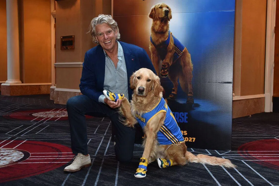 Roscoe, portraying Buddy the dog in Air Bud Returns, and Canadian director producer Robert Vince promote the movie at CinemaCon on April 15.