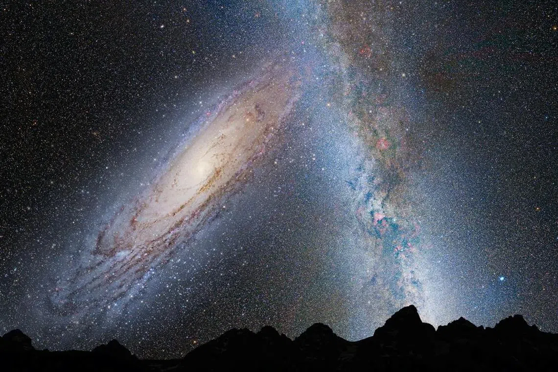 An illustration shows a stage in the potential merger between the Milky Way galaxy and the neighboring Andromeda galaxy.