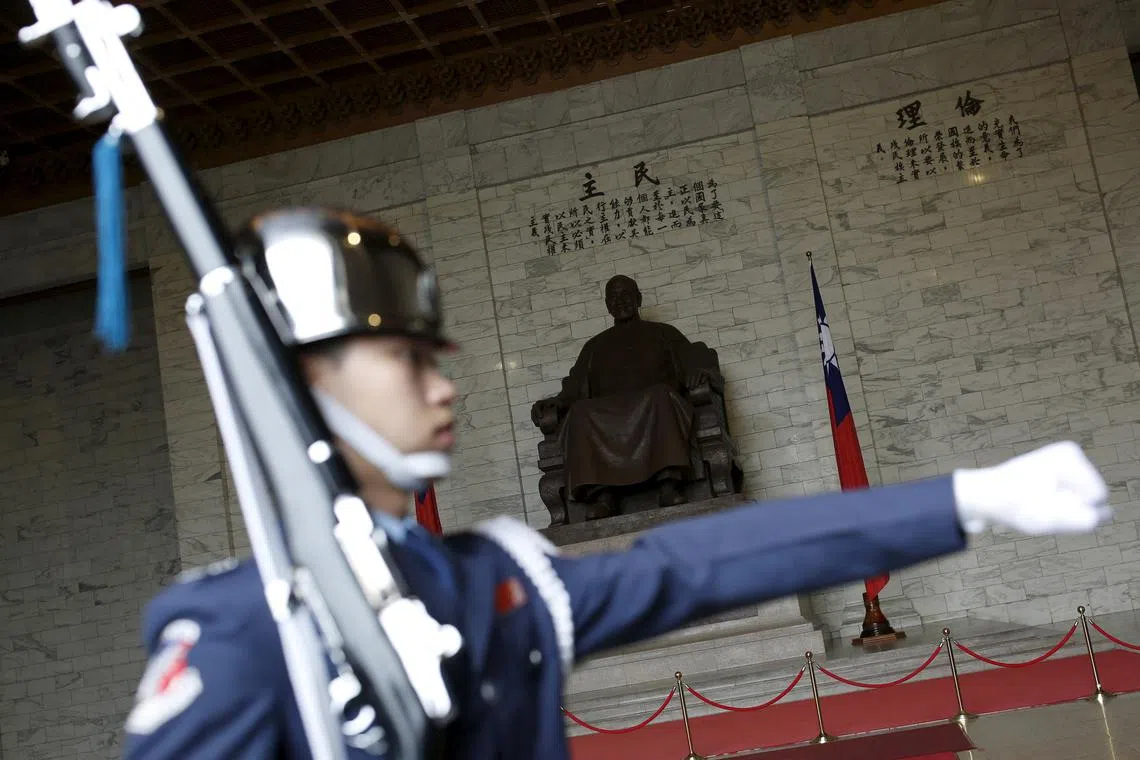 FILE PHOTO: FILE PHOTO: A military honor guard parade at the Chiang Kai-shek Memorial Hall in Taipei, Taiwan March 16, 2016. REUTERS/Tyrone Siu/File Photo