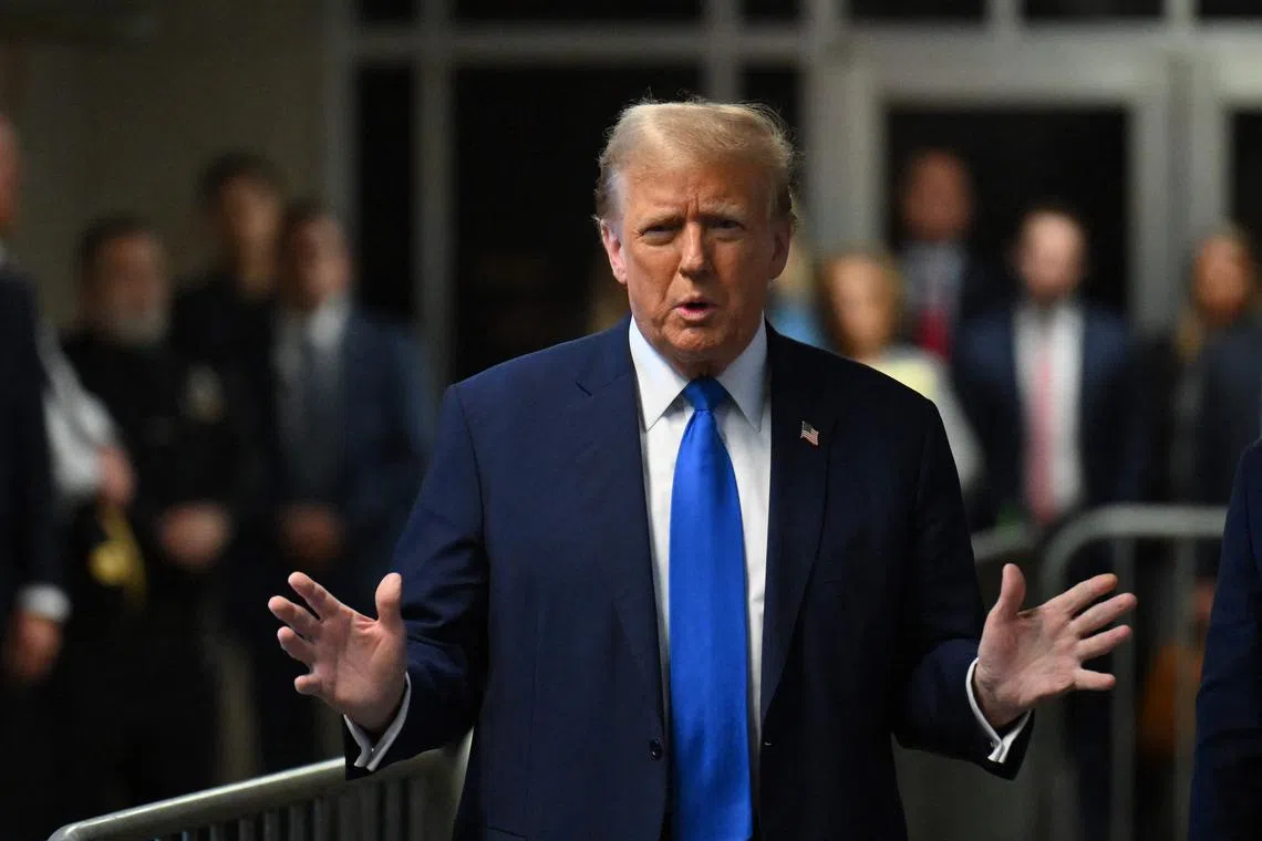 Former US president and Republican presidential candidate Donald Trump speaks to the press during his trial for allegedly covering up hush money payments linked to extramarital affairs at Manhattan Criminal Court in New York on April 22, 2024. AFP