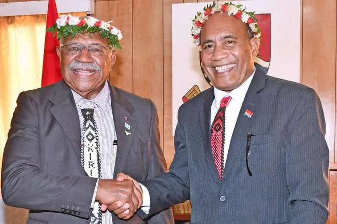 Fiji Prime Minister Sitiveni Rabuka (left) shaking hands with Kiribati President Taneti Maamau. 