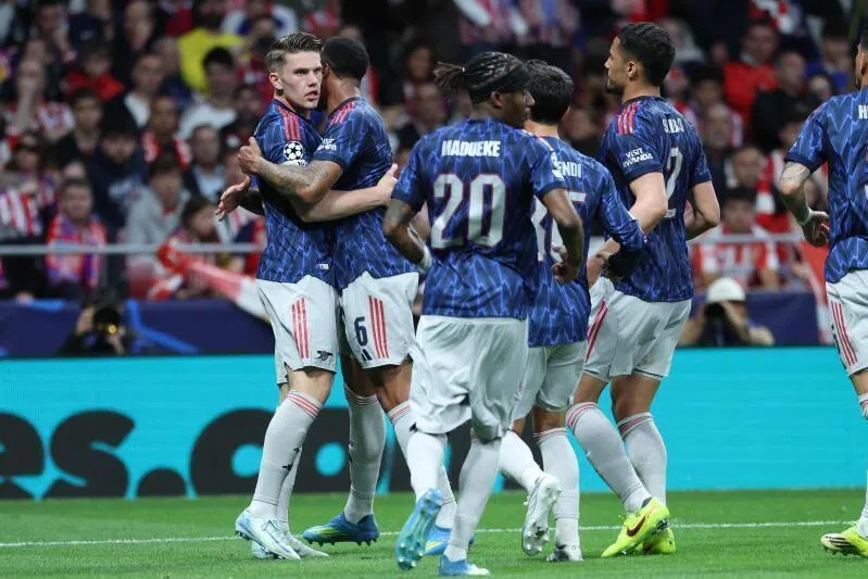 Arsenal players celebrate the opening goal scored by Arsenal's Swedish forward Viktor Gyokeres (left) during the UEFA Champions League semi-final first leg match against Atletico de Madrid.