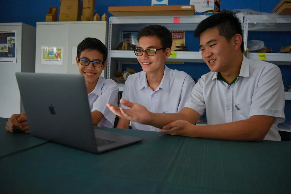 St Joseph's Institution students (from left) Elliot Wigmore, 13, Jack Wigmore, 16, and James Ryan Chen, 17, joined the school via the Innovation DSA category. 