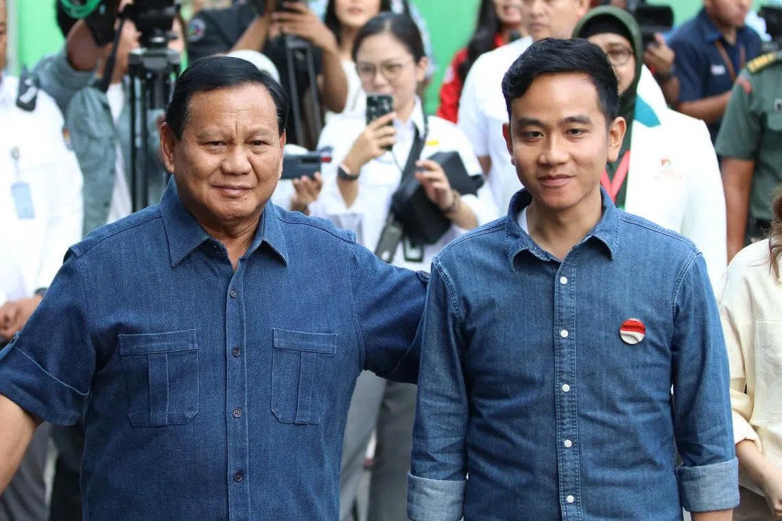 Indonesian presidential candidate Prabowo Subianto (left) and his running mate Gibran Rakabuming Raka, son of President Joko Widodo, trail in the latest opinion poll.