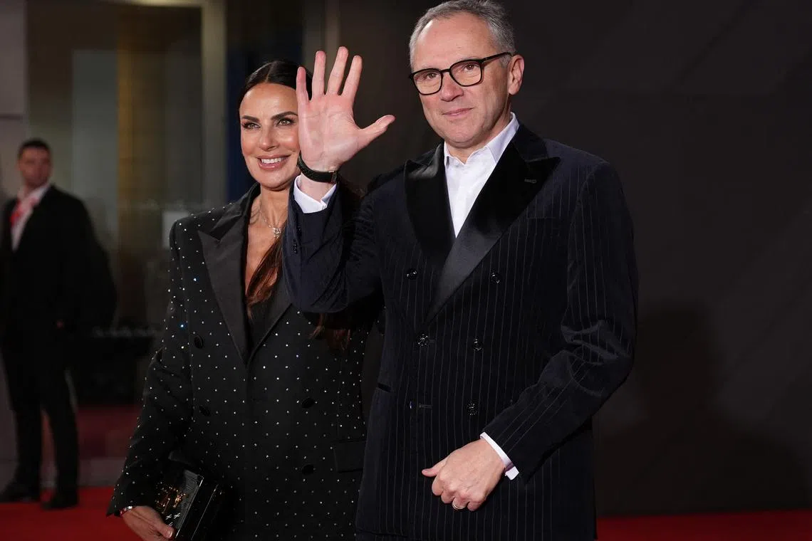 FILE PHOTO: Formula One F1 - F1 75 Live Season Launch - Arrivals - The O2, London, Britain - February 18, 2025 Formula One Group CEO Stefano Domenicali and his wife Silvia Colombo arrive before the launch REUTERS/Maja Smiejkowska/File Photo