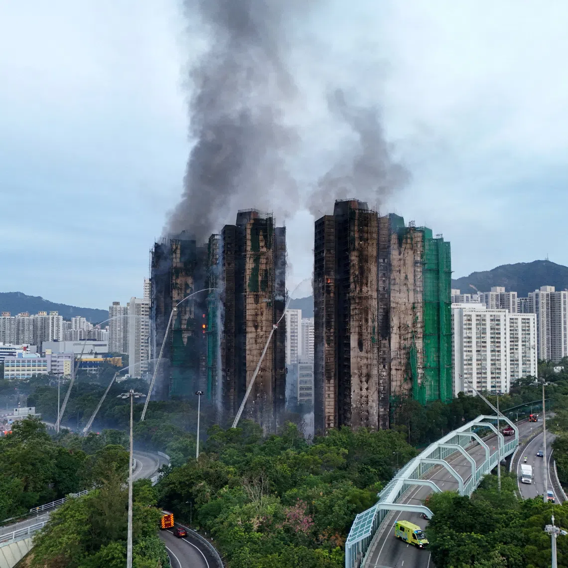 A drone view shows flames and thick smoke rising from the Wang Fuk Court housing estate in Hong Kong on Nov 27.