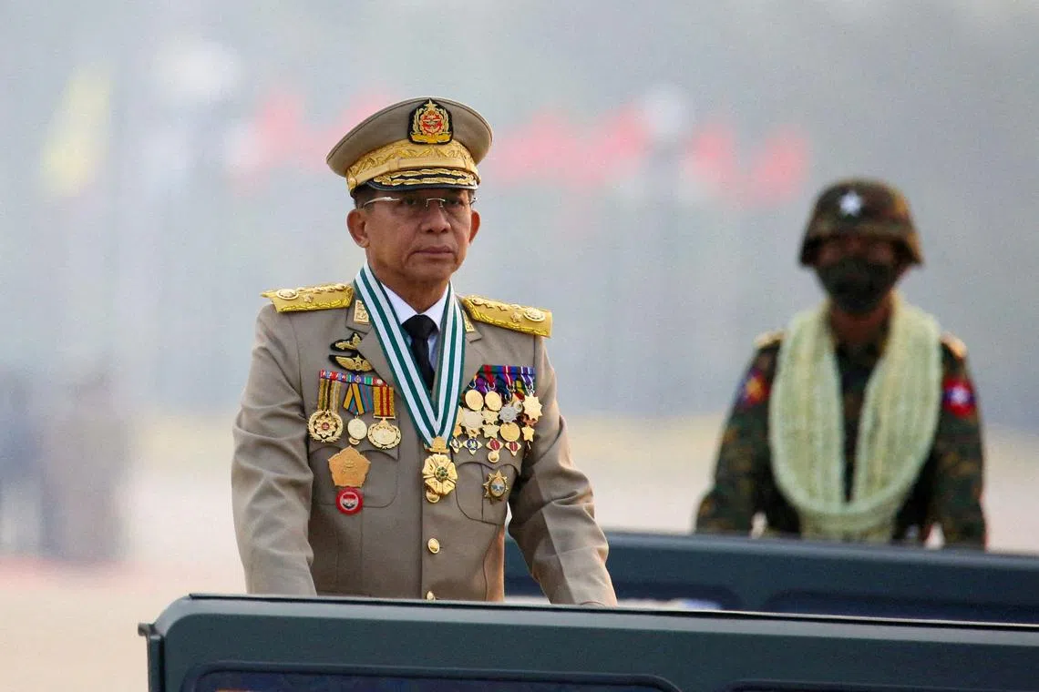 FILE PHOTO: Myanmar's junta chief Senior General Min Aung Hlaing, who ousted the elected government in a coup on February 1, 2021, presides over an army parade on Armed Forces Day in Naypyitaw, Myanmar, March 27, 2021. REUTERS/Stringer/File Photo