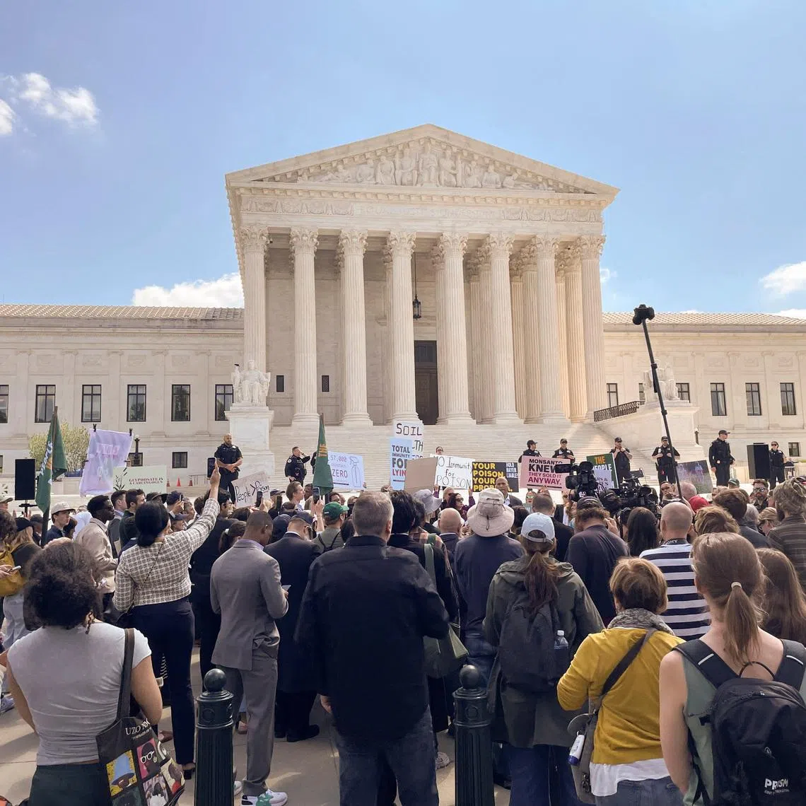 People who support the \"Make America Healthy Again\" movement rally against Bayer, the maker of Roundup weedkiller, outside the U.S. Supreme Court on the day the justices heard arguments in the German company’s effort to shut down thousands of lawsuits accusing it of failing to warn users that the active ingredient in this product allegedly causes cancer, in Washington, D.C., U.S., April 27, 2026. Picture taken with a phone. REUTERS/Leah Douglas