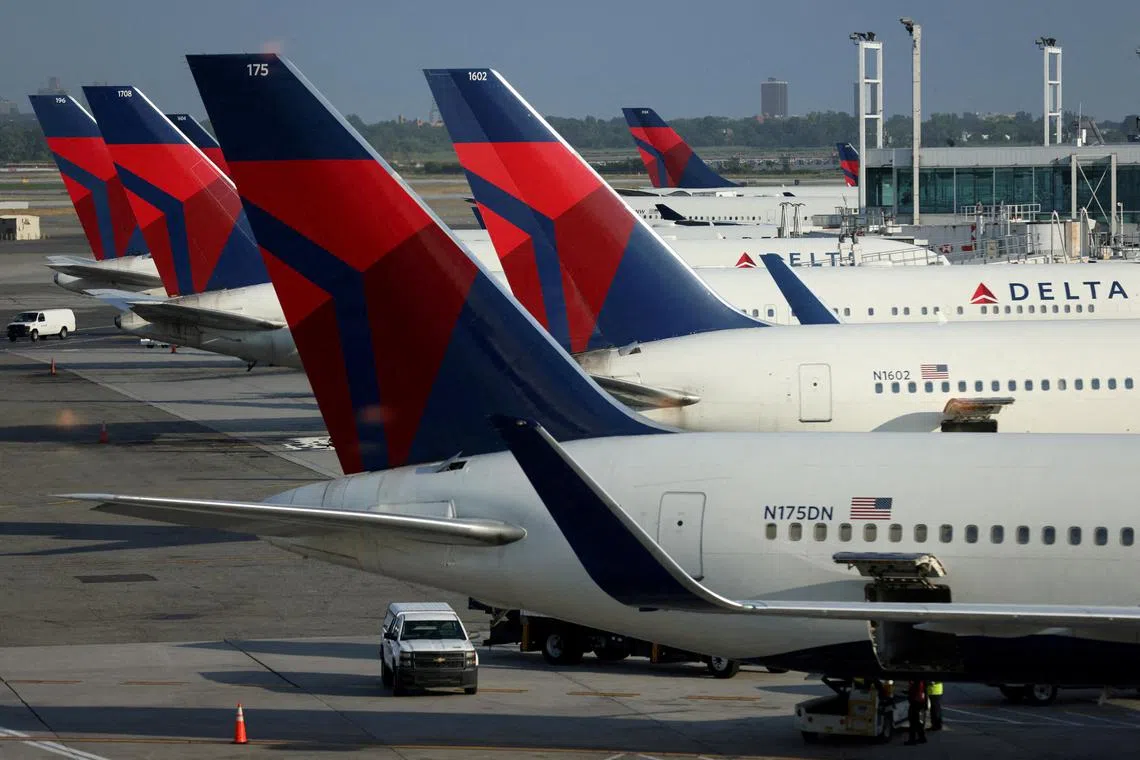 FILE PHOTO: Delta Air Lines planes are seen at John F. Kennedy International Airport on the July 4th weekend in Queens, New York City, U.S., July 2, 2022. REUTERS/Andrew Kelly/File Photo