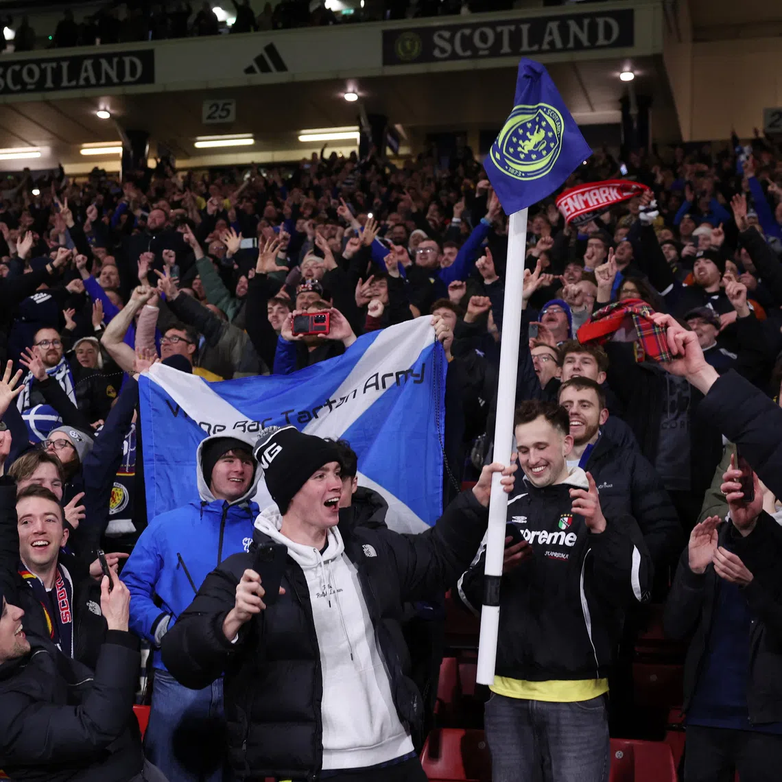 Soccer Football - FIFA World Cup - UEFA Qualifiers - Group C - Scotland v Denmark - Hampden Park, Glasgow, Scotland, Britain - November 18, 2025 Scotland fans celebrate after they qualify for the World Cup Action Images via Reuters/Lee Smith