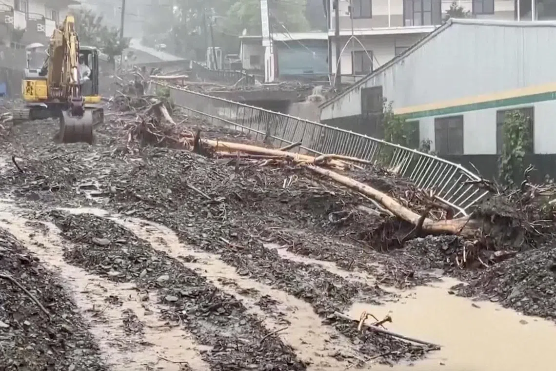 Debris on a flooded street following heavy rains due to Typhoon Khanun, in Nantou county, Taiwan, on Aug 5.