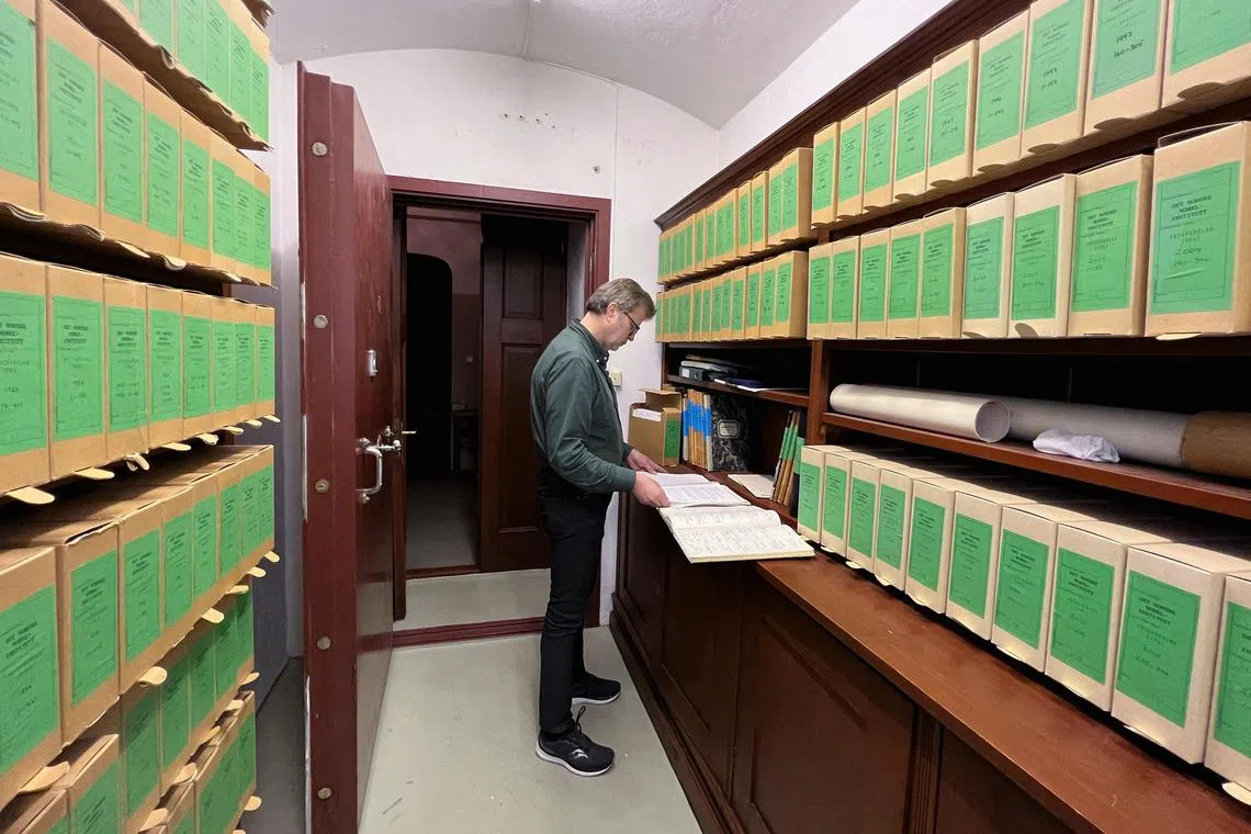 Bjoern Vangen, head librarian at the Norwegian Nobel Institute, reads nominations made to the 1973 Nobel Peace Prize, in the archive room of the Norwegian Nobel Institute in Oslo, Norway, January 3, 2023. 